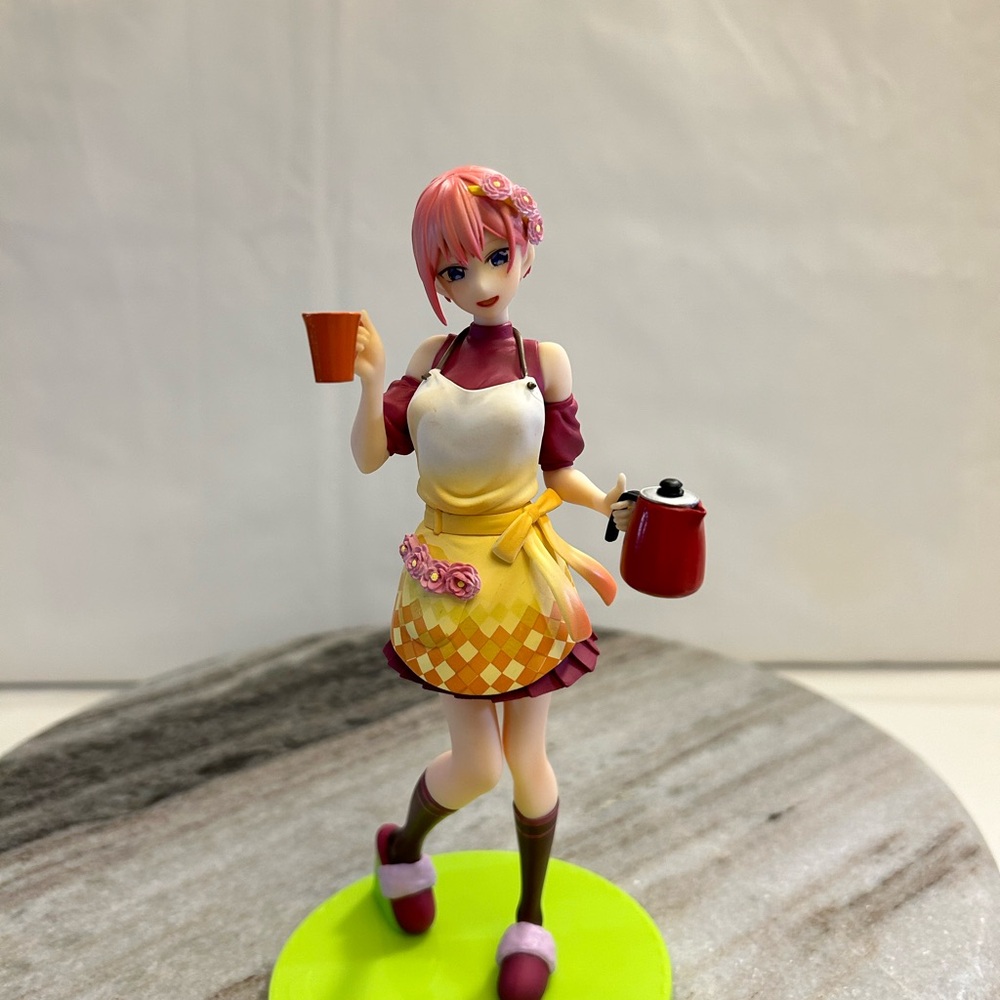 Pink and Yellow Figurine with Apron